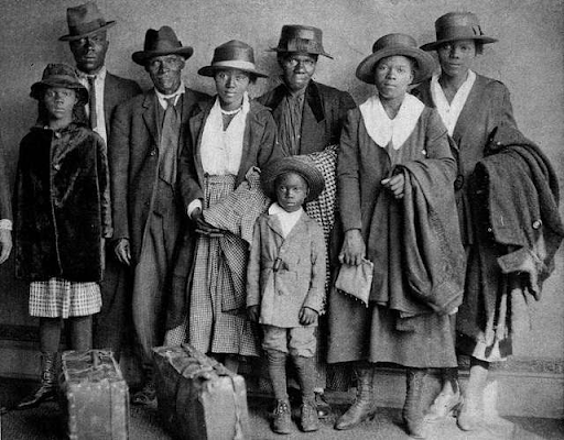 family standing together in formal wear