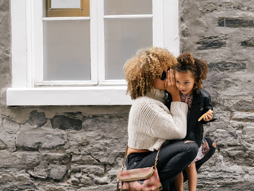 black mom holding her child