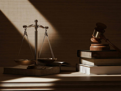 a judges scale and a book on a table