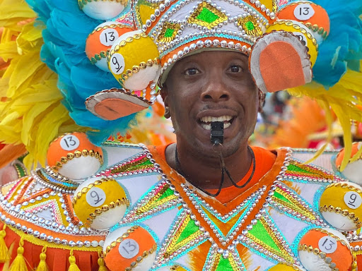 man wearing white green and orange costume 
