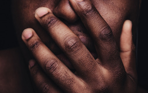 mouth over hand