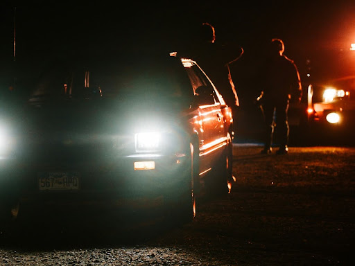 white car on road during night time 