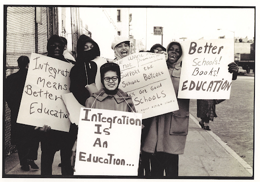 students gathered with protest signs 