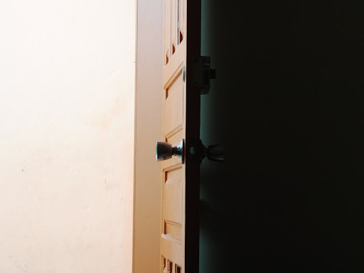 closed door with a light shining on the door