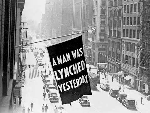 A Flag Reading 'A MAN WAS LYNCHED YESTERDAY'