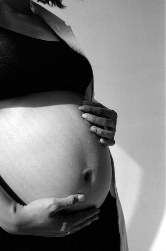 black and white photograph of a pregnant woman