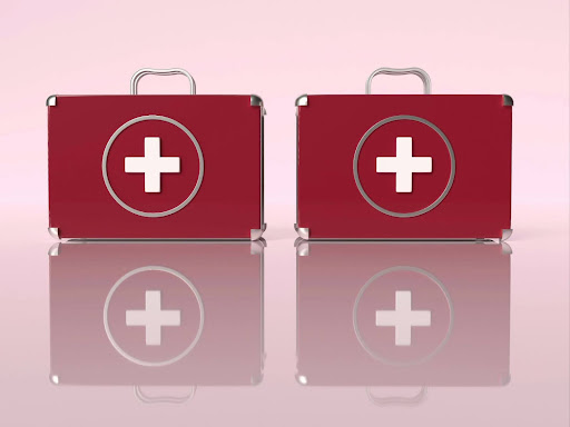 red suitcases with white crosses on them