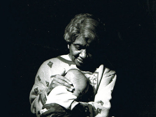 clara "mother" hale holding a child to her chest