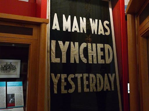 a sign saying a man was lynched yesterday
