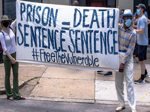 banner that says prison sentence equals death sentence