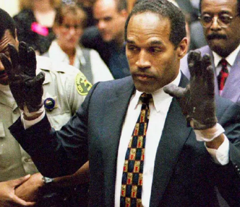 oj simpson holding up gloved hands 
