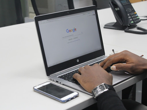 person typing at a laptop