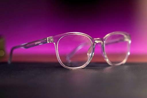 a pair of glasses sitting on top of a table 