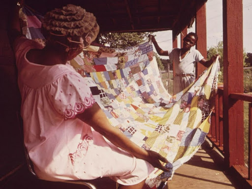 black woman quilting