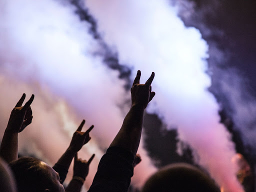 hands raised at a concert
