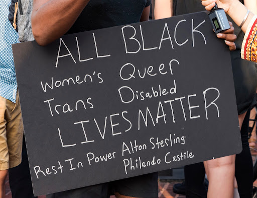 chalk sign that says all black lives matter 