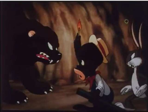caricature of black person with a bear in a cave 