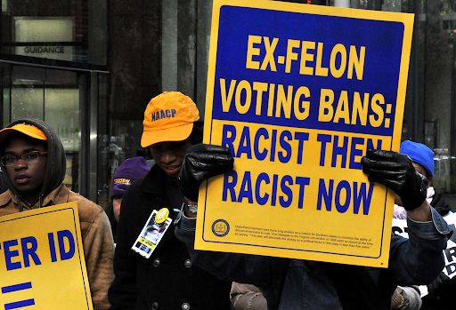 protestors holding a sign 