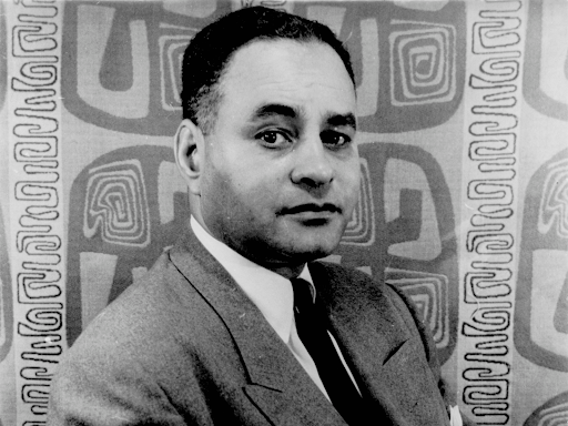 ralph bunche looking straight ahead with an eyebrow raised