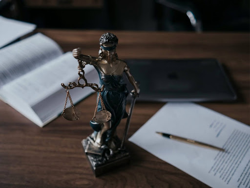 a statue of a lady of justice hold a scale of justice