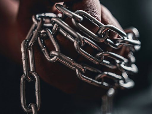 person holding silver chain link