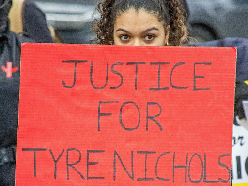 person holding justice for tyre nicols protest sign