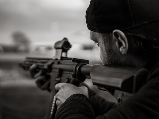person holding a sniper rifle