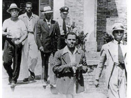 group of white men escorting sam 