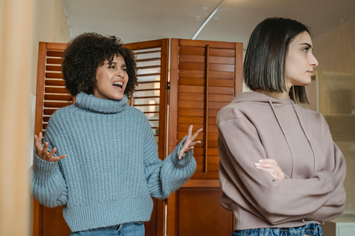 upset women scolding in room