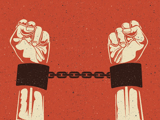 a persons hand ins trained steel handcuffs