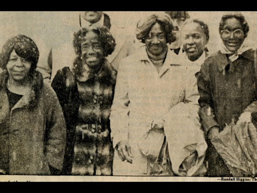 five black women standing together