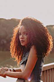 black woman smiling in the sun