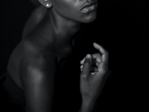 black woman beckoning with finger 