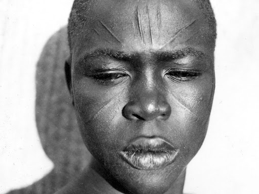african person with skin tattoo