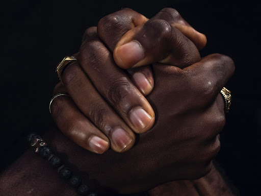 two hands clasped together