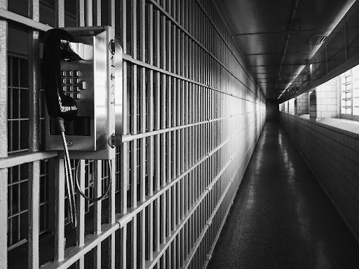 empty jail cells in black and white