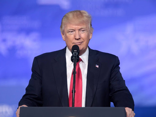 president trump standing at a podium