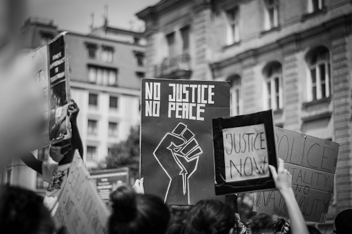 grayscale photo of people protesting