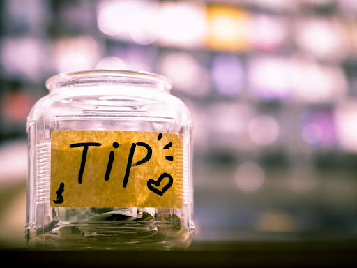 clear jar with tip written on it