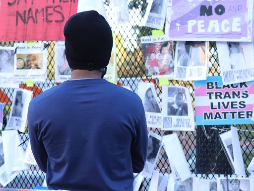 protest signs attached to a fence