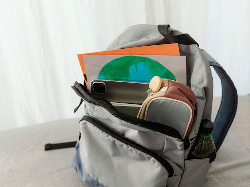 open backpack with school supplies