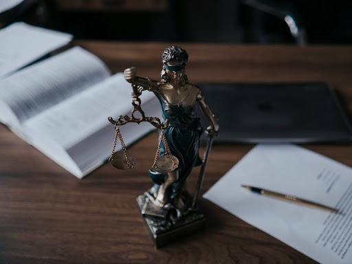 a statue of a lady of justice holding a scale of justice 