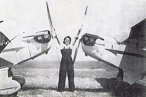 willa brown standing in between two planes