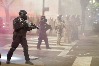 Officers in riot gear with guns