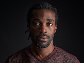 black man staring ahead