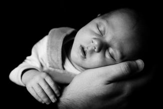 Baby sleeping in hand