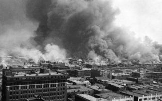 The "Little Africa” section of Tulsa, OK in flames during the 1921 race riot