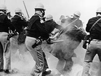 photo of bloody sunday in alabama with police attacking protestors