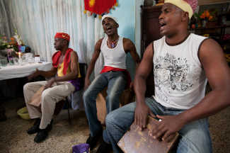 Men playing wooden instruments in Havana, Cuba