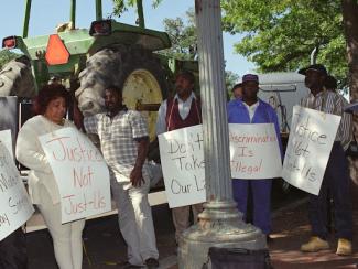 protestors holding signs
